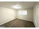 Bright bedroom featuring neutral walls, carpet flooring, and a window for natural light at 3375 Brenda Ln, Lithia Springs, GA 30122