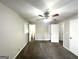 Spacious main bedroom with a ceiling fan, plush carpet and ample closet space at 3375 Brenda Ln, Lithia Springs, GA 30122