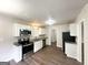 Modern kitchen featuring stainless steel appliances, granite countertops, and updated cabinets at 3375 Brenda Ln, Lithia Springs, GA 30122
