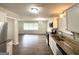 Open-concept living space with hardwood floors, granite countertops, and stainless steel appliances at 3375 Brenda Ln, Lithia Springs, GA 30122