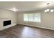 Inviting living room with fireplace, hardwood floors, and windows for natural light at 3375 Brenda Ln, Lithia Springs, GA 30122