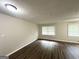Open living room featuring hardwood floors, neutral walls, and natural light from multiple windows at 3375 Brenda Ln, Lithia Springs, GA 30122