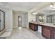 Modern bathroom with double vanity, granite countertops, tiled floors, a glass shower, and access to bedroom at 101 Sumner Place Ct, Peachtree City, GA 30269