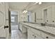Bathroom features a granite countertop and a large mirror at 101 Sumner Place Ct, Peachtree City, GA 30269