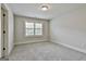 Bright bedroom with large window and neutral tones at 101 Sumner Place Ct, Peachtree City, GA 30269