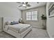 Well-lit bedroom with a ceiling fan and window at 101 Sumner Place Ct, Peachtree City, GA 30269