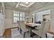 Dining room with coffered ceiling, wainscoting, and view to the entry way at 101 Sumner Place Ct, Peachtree City, GA 30269