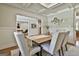 Elegant dining room with stylish decor and an open doorway to an office or study at 101 Sumner Place Ct, Peachtree City, GA 30269