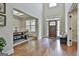 Bright foyer with hardwood floors leading into a dining room area at 101 Sumner Place Ct, Peachtree City, GA 30269
