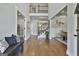 Two-story foyer with hardwood floors, iron railing staircase, and open views to other living spaces at 101 Sumner Place Ct, Peachtree City, GA 30269