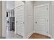 Hallway showcasing doors to laundry room and other rooms at 101 Sumner Place Ct, Peachtree City, GA 30269
