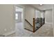 Hallway with carpet, a wooden stair railing, and doorways to the bedrooms and other rooms of the house at 101 Sumner Place Ct, Peachtree City, GA 30269