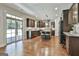 Spacious kitchen with dark cabinets, stainless steel appliances, and a large island with seating at 101 Sumner Place Ct, Peachtree City, GA 30269