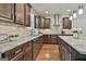 Beautiful kitchen showcases granite counters, wooden cabinets, and stainless steel hood at 101 Sumner Place Ct, Peachtree City, GA 30269