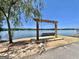 Lakeside swing with a view of a calm lake, creating a relaxing spot for residents to enjoy nature at 101 Sumner Place Ct, Peachtree City, GA 30269