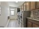 Bright laundry room boasts new machines, granite counters, and overhead cabinets at 101 Sumner Place Ct, Peachtree City, GA 30269