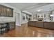 Open-concept living area features wood floors, built-in bookshelves and a fireplace at 101 Sumner Place Ct, Peachtree City, GA 30269