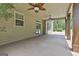 Relaxing covered patio featuring ceiling fans and neutral toned flooring at 101 Sumner Place Ct, Peachtree City, GA 30269