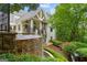 Elegant backyard with a tiered pool and a spiral staircase from the upper level at 8957 Old Southwick Pass, Johns Creek, GA 30022