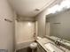 Bathroom featuring granite vanity top, framed mirror, and shower over tub at 3814 Clear Lake Nw Way, Acworth, GA 30101