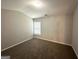 Bedroom with neutral carpet, window, and neutral colored walls and ceiling at 3814 Clear Lake Nw Way, Acworth, GA 30101