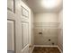 A compact laundry room includes shelving and hookups for a washer and dryer at 3814 Clear Lake Nw Way, Acworth, GA 30101