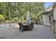 Outdoor deck features a dining table and outdoor seating perfect for entertaining at 209 Smokerise Trce, Peachtree City, GA 30269
