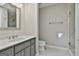 Bright bathroom features a large mirror, gray vanity and walk in shower at 209 Smokerise Trce, Peachtree City, GA 30269