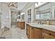 Luxurious bathroom featuring a marble vanity, decorative mirrors, and a walk-in shower at 209 Smokerise Trce, Peachtree City, GA 30269