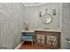 Charming bathroom with wallpaper and vanity at 209 Smokerise Trce, Peachtree City, GA 30269