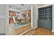 Bright dining room area adjacent to the kitchen with wood floors and a decorative chandelier above the dining table at 209 Smokerise Trce, Peachtree City, GA 30269