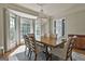 Bright dining room with a chandelier, bay window and a view to the entrance foyer at 209 Smokerise Trce, Peachtree City, GA 30269