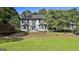 Charming two-story home with a well-manicured lawn, brick exterior, and lots of curb appeal at 209 Smokerise Trce, Peachtree City, GA 30269