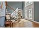 Bright foyer featuring high ceilings, a staircase with iron spindles and double front doors at 209 Smokerise Trce, Peachtree City, GA 30269