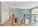 Elegant foyer with hardwood floors, a statement chandelier and beautiful staircase at 209 Smokerise Trce, Peachtree City, GA 30269