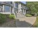 Stately two-story home with brick exterior, large windows, and a paved driveway at 209 Smokerise Trce, Peachtree City, GA 30269