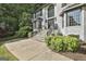Stately two-story home with brick exterior, large windows, and a paved driveway at 209 Smokerise Trce, Peachtree City, GA 30269