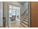 A hallway is leading to a dining room with a chandelier and a table at 209 Smokerise Trce, Peachtree City, GA 30269
