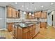 Spacious kitchen featuring custom cabinets, granite countertops, tile backsplash, and stainless steel appliances at 209 Smokerise Trce, Peachtree City, GA 30269