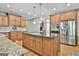 Spacious kitchen with stainless steel appliances, granite countertops, and a large island at 209 Smokerise Trce, Peachtree City, GA 30269