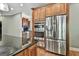 The kitchen has a stainless steel refrigerator and oven at 209 Smokerise Trce, Peachtree City, GA 30269