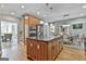 Gourmet kitchen with center island, stainless appliances, and modern cabinetry at 209 Smokerise Trce, Peachtree City, GA 30269