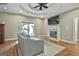 Cozy living room with fireplace, hardwood floors, and a sliding door at 209 Smokerise Trce, Peachtree City, GA 30269