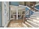 Open living area showing stairs, large windows, and a hardwood floor at 209 Smokerise Trce, Peachtree City, GA 30269