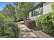 Beautiful landscaping and brick exterior in a serene wooded neighborhood at 209 Smokerise Trce, Peachtree City, GA 30269