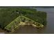 Aerial view shows lakefront property boundary marked in yellow surrounded by mature trees at 255 Mcintosh Estates Dr, Sharpsburg, GA 30277