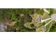 Aerial view of estate home featuring a long drive, well-maintained grounds and lake access at 255 Mcintosh Estates Dr, Sharpsburg, GA 30277
