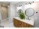 Updated bathroom showcases a dual sink vanity with modern fixtures and ample space at 255 Mcintosh Estates Dr, Sharpsburg, GA 30277
