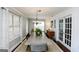 Inviting dining room featuring a classic chandelier, hardwood flooring, and ample natural light at 255 Mcintosh Estates Dr, Sharpsburg, GA 30277