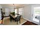 Bright and spacious dining area featuring hardwood flooring and a chandelier at 255 Mcintosh Estates Dr, Sharpsburg, GA 30277